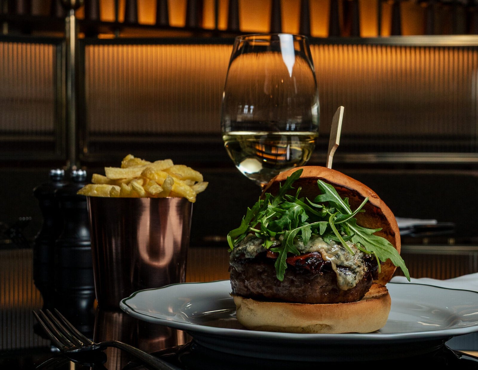 F&B product photography of Vince Miklos, hamburger presented with french fries and a glass of wine