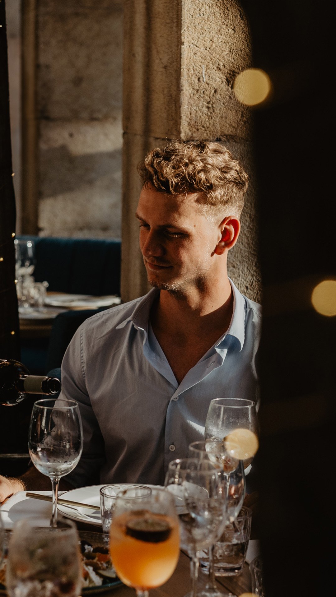 Vince Miklos sitting at a restaurant table at Columbus Culinary Bar, Sangria and elegant setting